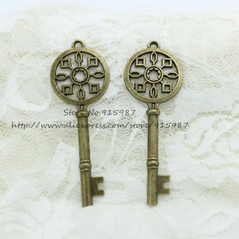 

Sweet Bell 15pcs/lot 25*69mm Antique Bronze Metal Alloy Hollow Filigree Lovely Key Jewelry Pendant Charms D0799