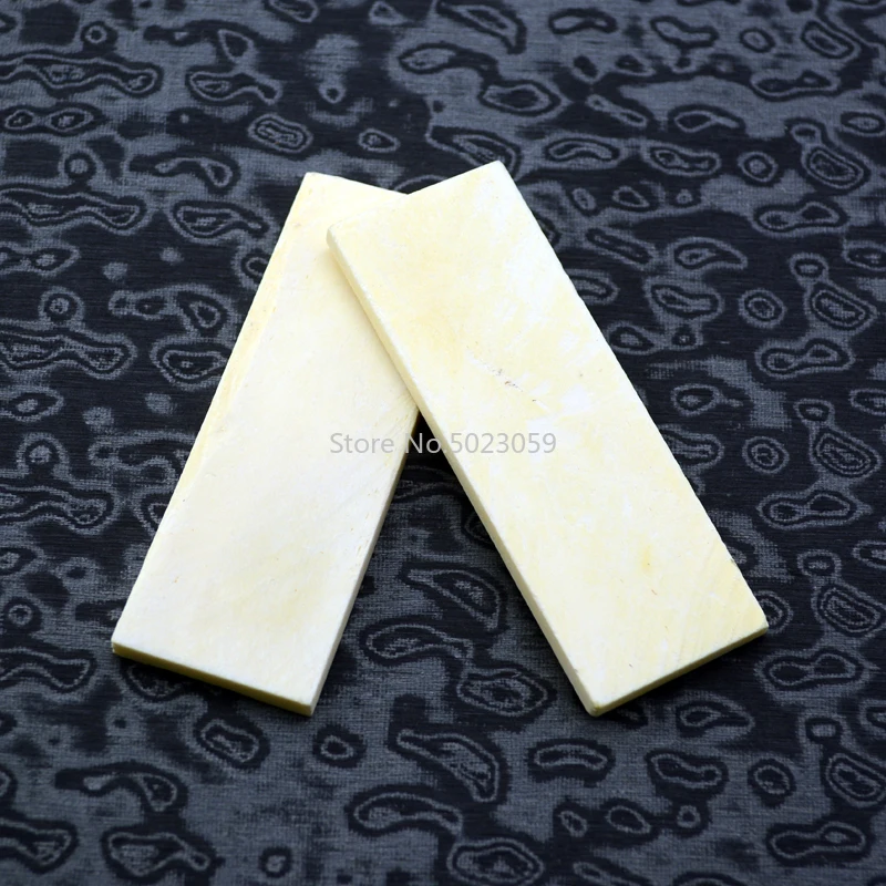 

2pieces Lmitation bovine bone material for DIY knife handle material For Damascus cutting tool septum 90x30x5mm