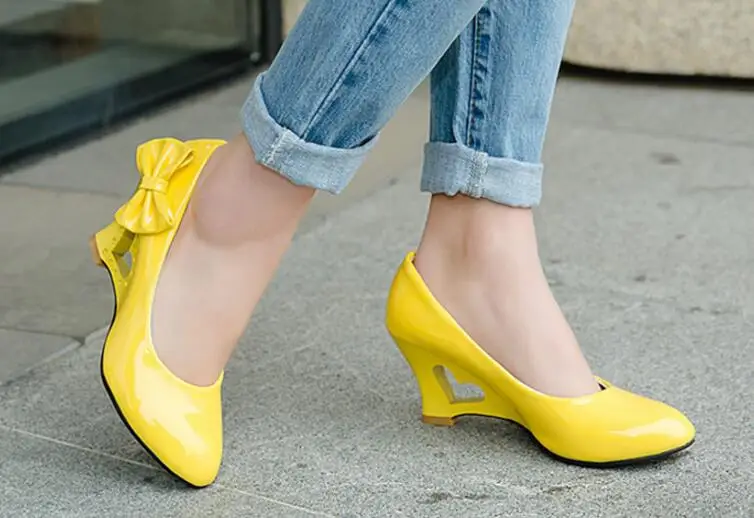 In the spring and autumn season  Bow fashionable candy color patent leather shoes  Hollowed-out wedge size women's shoes 34-43