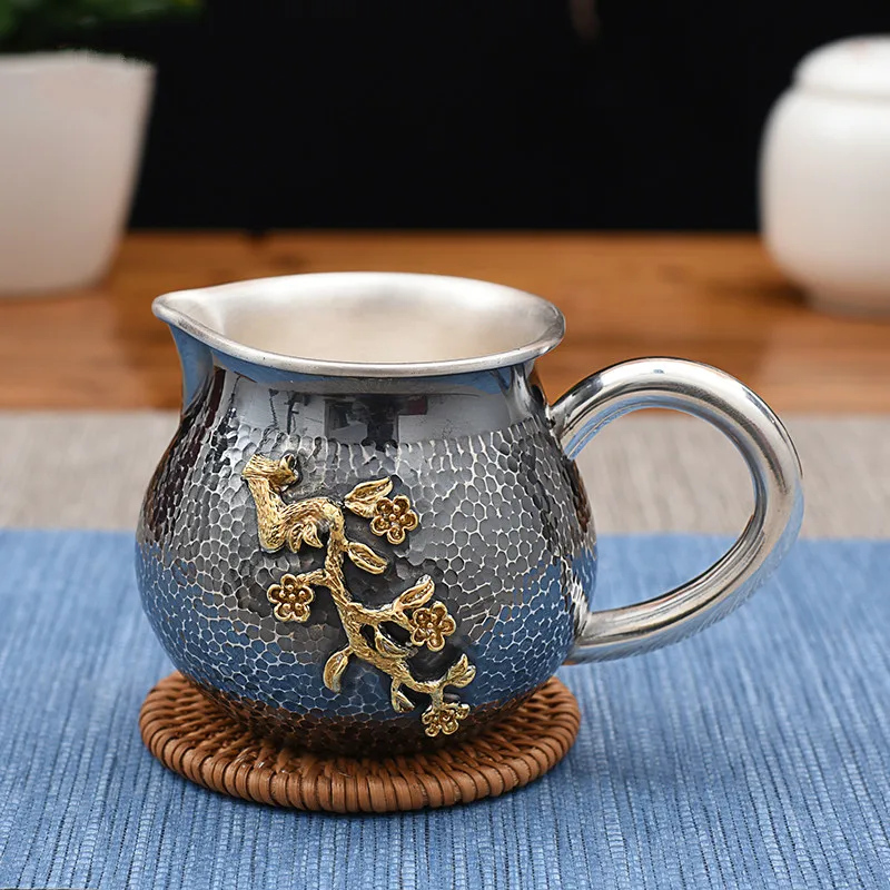 

Pure Silver Tea Hailiang Old Hammered Gold-plated Plum Blossom Fair Cup Pure Silver Tea Haikungfu Tea Separator