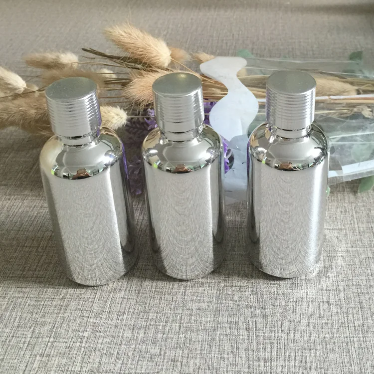 hot 50ml glass essential oil bottle with ribbed cap wholesale ,high-grade sub-bottling UV electroplating silver glass bottle