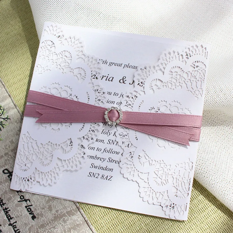 

Wedding invitations laser cut white floral paper invite with envelop violet ribbon rhinestone decorated