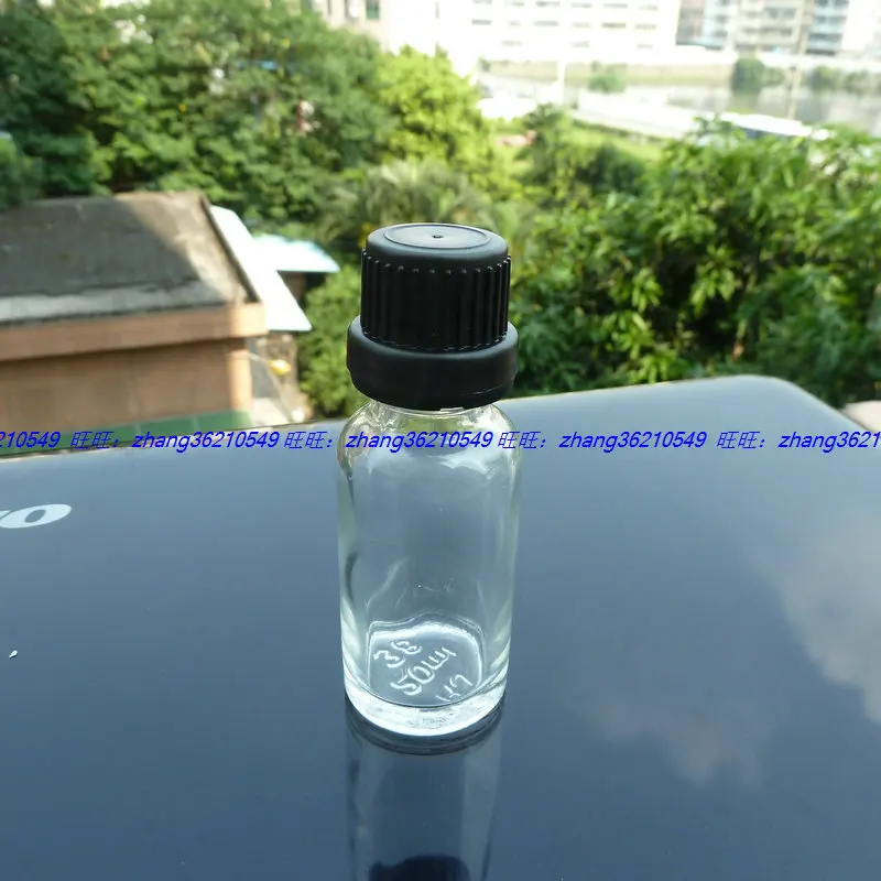 20ml clear/transparent Glass Essential Oil Bottle With black plastic burglarproof cap. Oil vial, Essential Oil Container