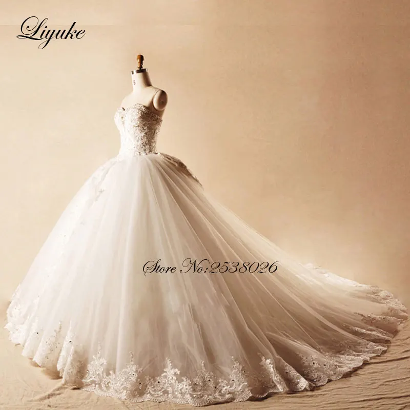 فستان زفاف Liyuke أنيق بدون حمالات مع فيونكة 2019 مزين بالخرز من الدانتيل فستان زفاف الأميرة رداء de mariage