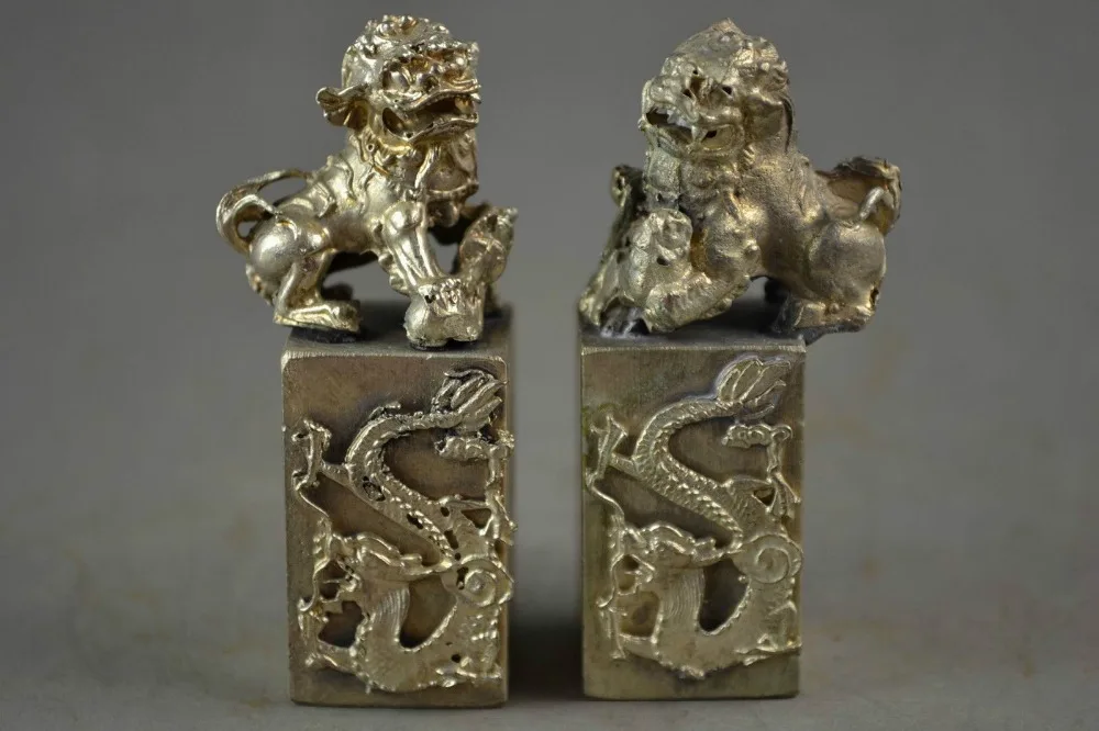 

A Pair of Exquisite old Chinese miao silver statue carved dragon lucky kirin seals