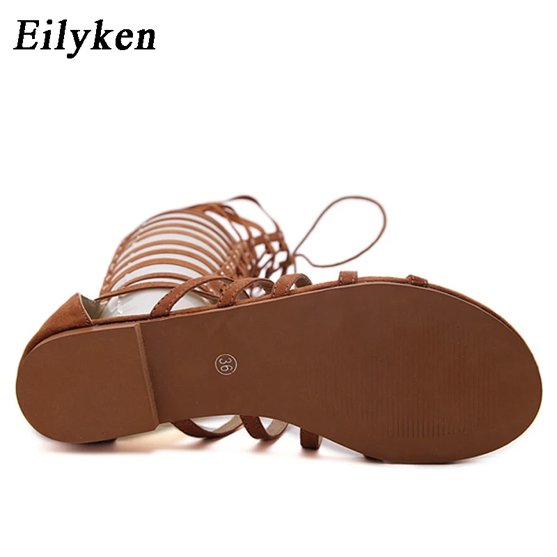 Eilyken Designer Women Sandals Strappy Open toe Knee High Summer Gladiator Flat Sandals Roman Bandage Casual Boots Shoes