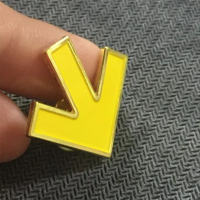 Collection of metal yellow arrow direction lapel yellow paint badges