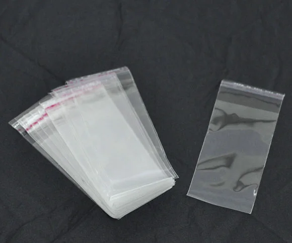 

Free shipping-200Pcs Clear Self Adhesive Seal Plastic Bags 10x4cm M0857