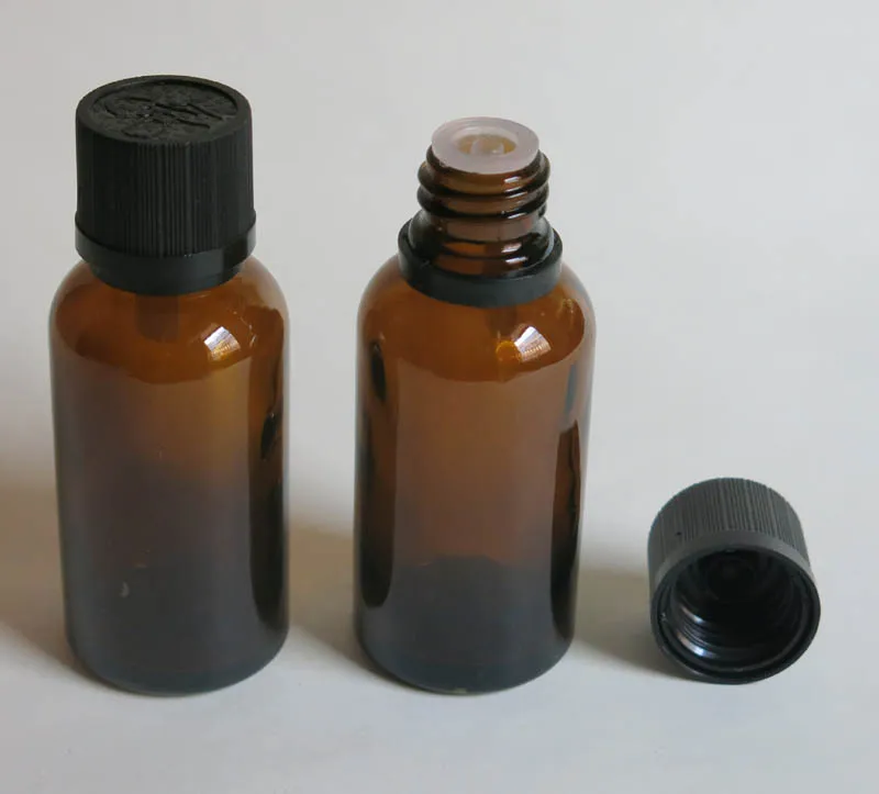 

100pcs wholesale 1 Oz amber glass bottle with Acid & Alkali Resistant Phenolic Screw cap for Light Sensitive Material