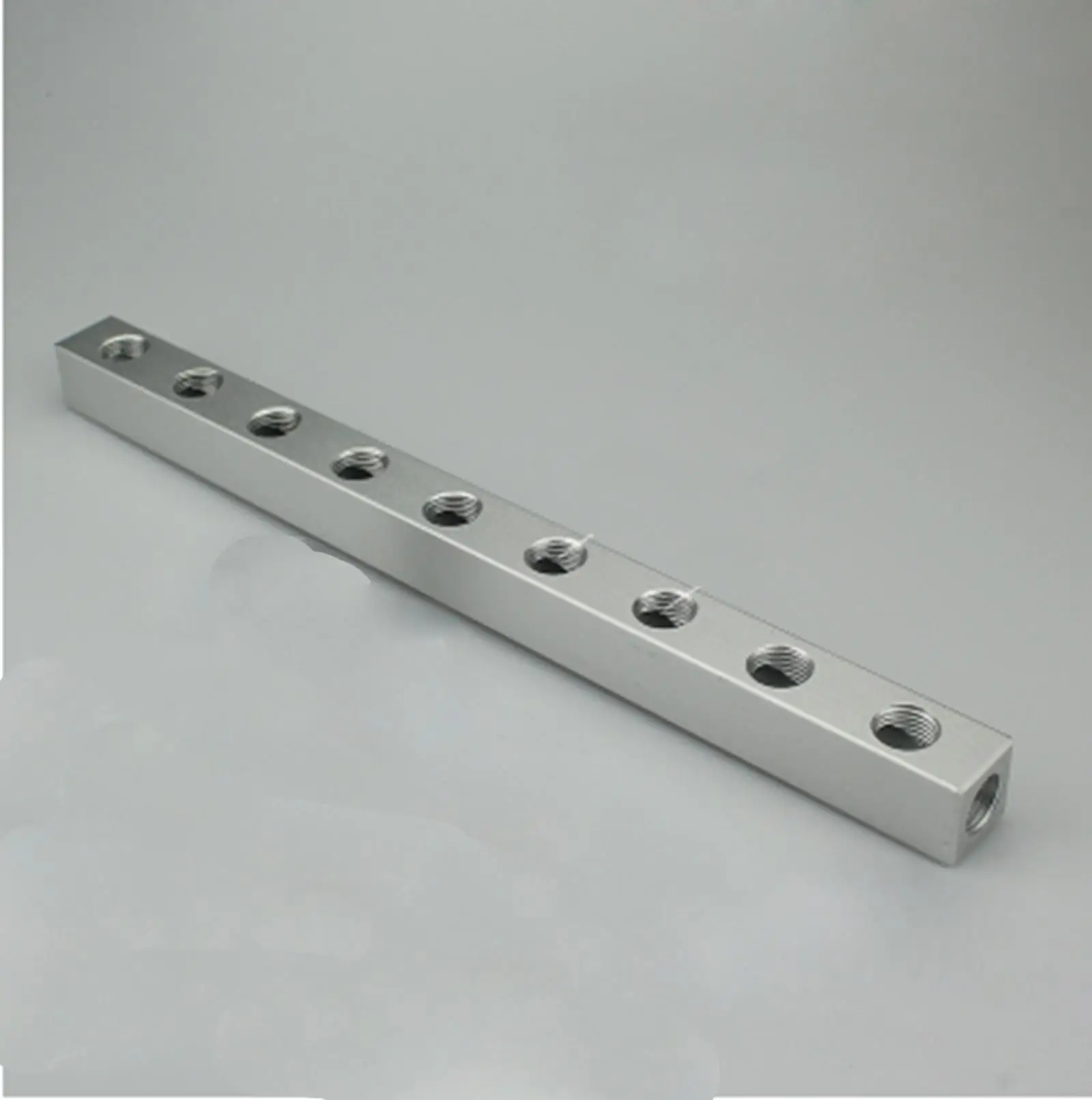 

Aluminum 20x20mm 1/4" BSP Female 9 Way 12 Port Pneumatic Fitting Manifold Block Splitter