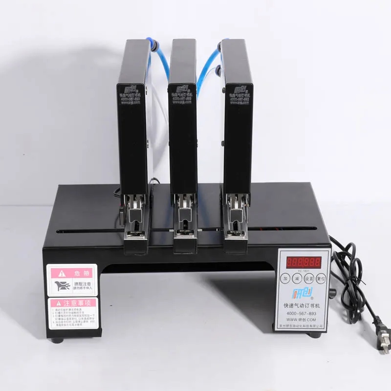 ماكينة تجليد الكتب ذات الدباسة الهوائية ثلاثية الرؤوس ماكينة تجليد الدباسة الكهربائية الأوتوماتيكية ماكينة تسمير مع 180 مرة/دقيقة