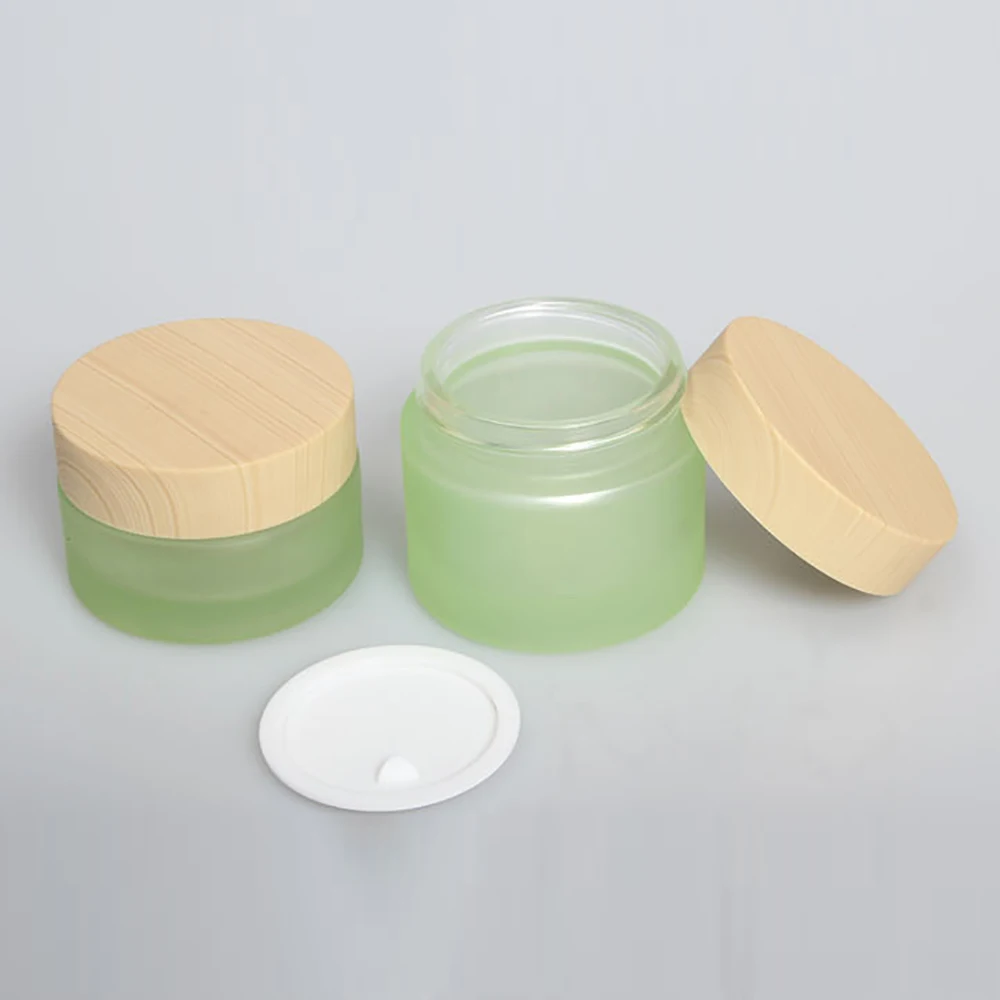 Sale well cosmetic cream jar glass 50g, 1.7 oz green cosmetic packaging for BB/night cream with yellow wood cover