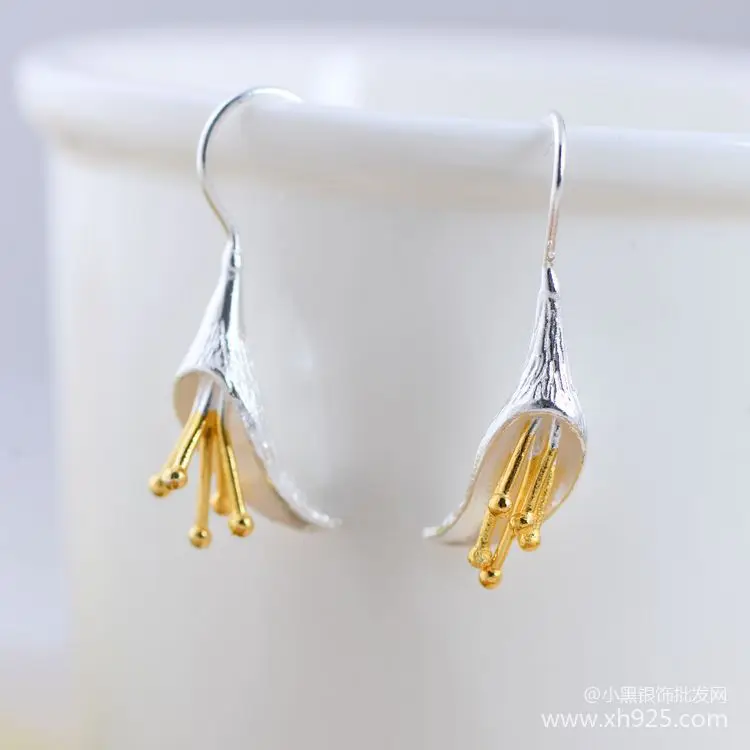 

Серьги женские из серебра 100% пробы с золотым цветком