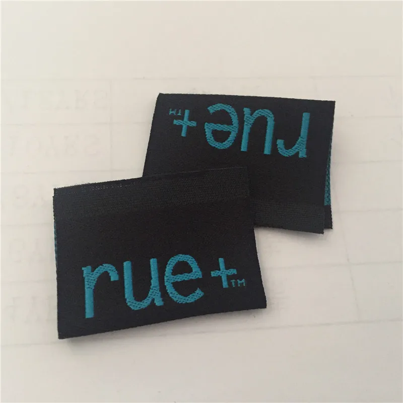 

Custom High Density Black Background with Blue Writing Clothing Woven Label