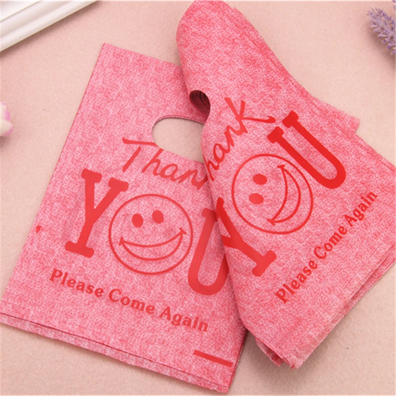 Hot Sale New Style Wholesale 100pcs/lot 15*20cm Red Thank You Gift Bags With Smile Face Plastic Christmas Packaging Gift Bags