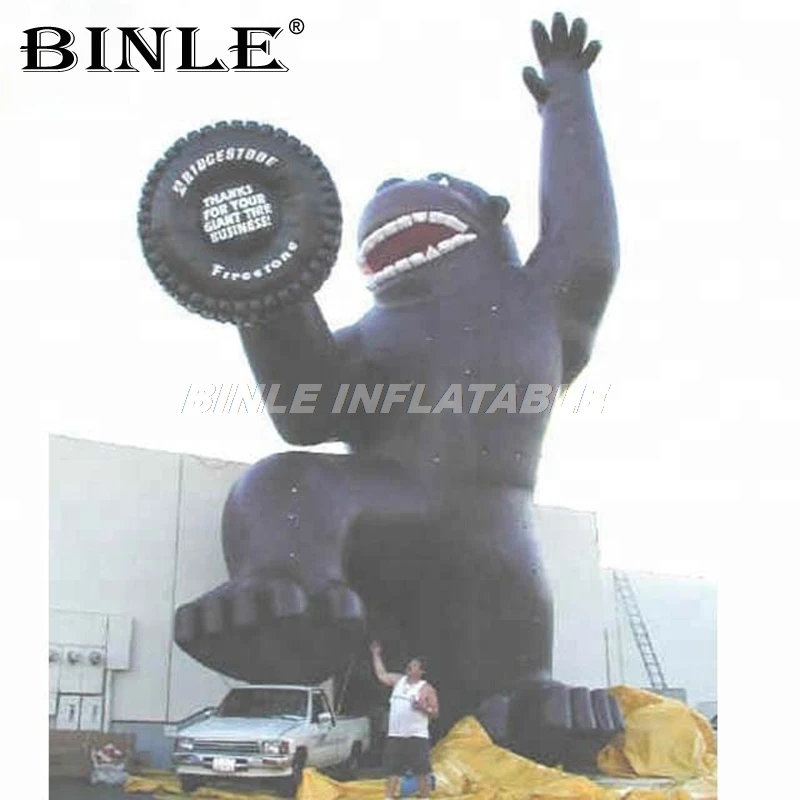 

Custom mascot cartoon advertising decoration inflatable monkey 20ft giant inflatable gorilla balloon with car tire for promotion