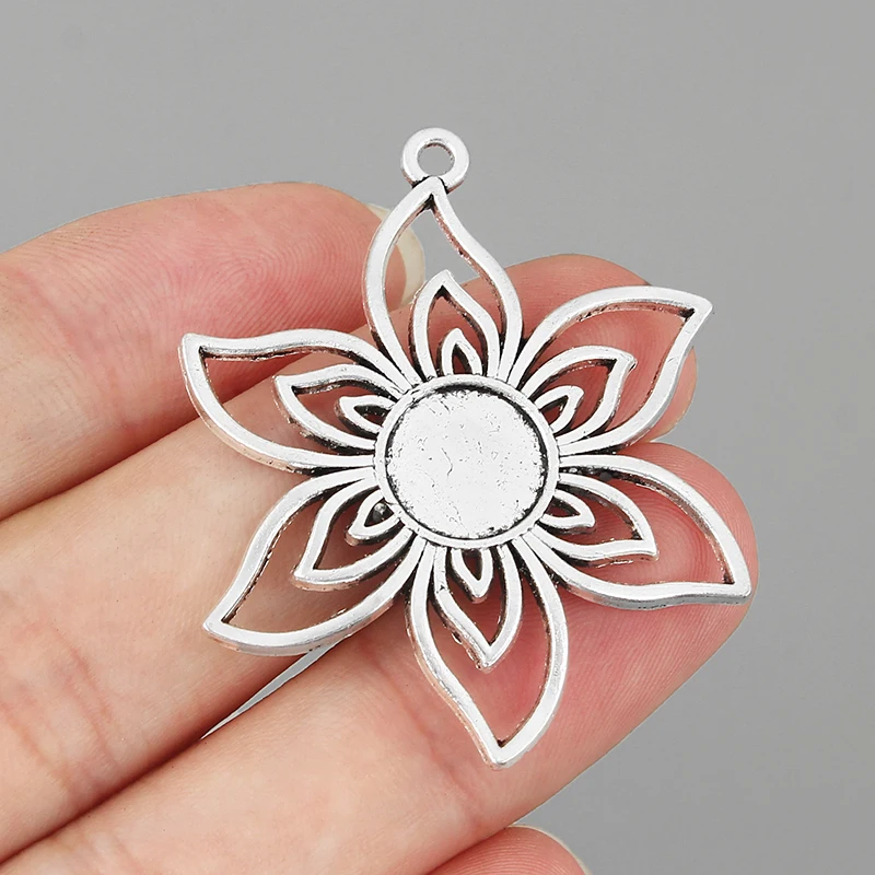 

10PCS Tibetan Silver Hollow Sun Flowers Charms Pendants 10mm Round Bezel Tray Cameo Cabochon Setting for DIY Necklace Jewelry