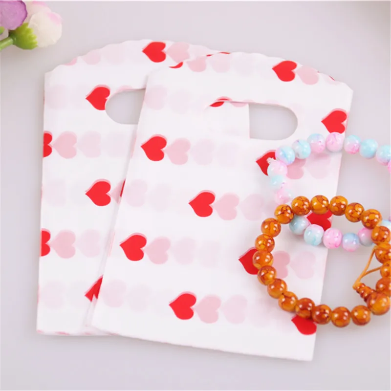 New Design Wholesale 50pcs/lot 9*15cm Mini Wedding Candy Pouches with Small Red Heart for lipstick Packaging