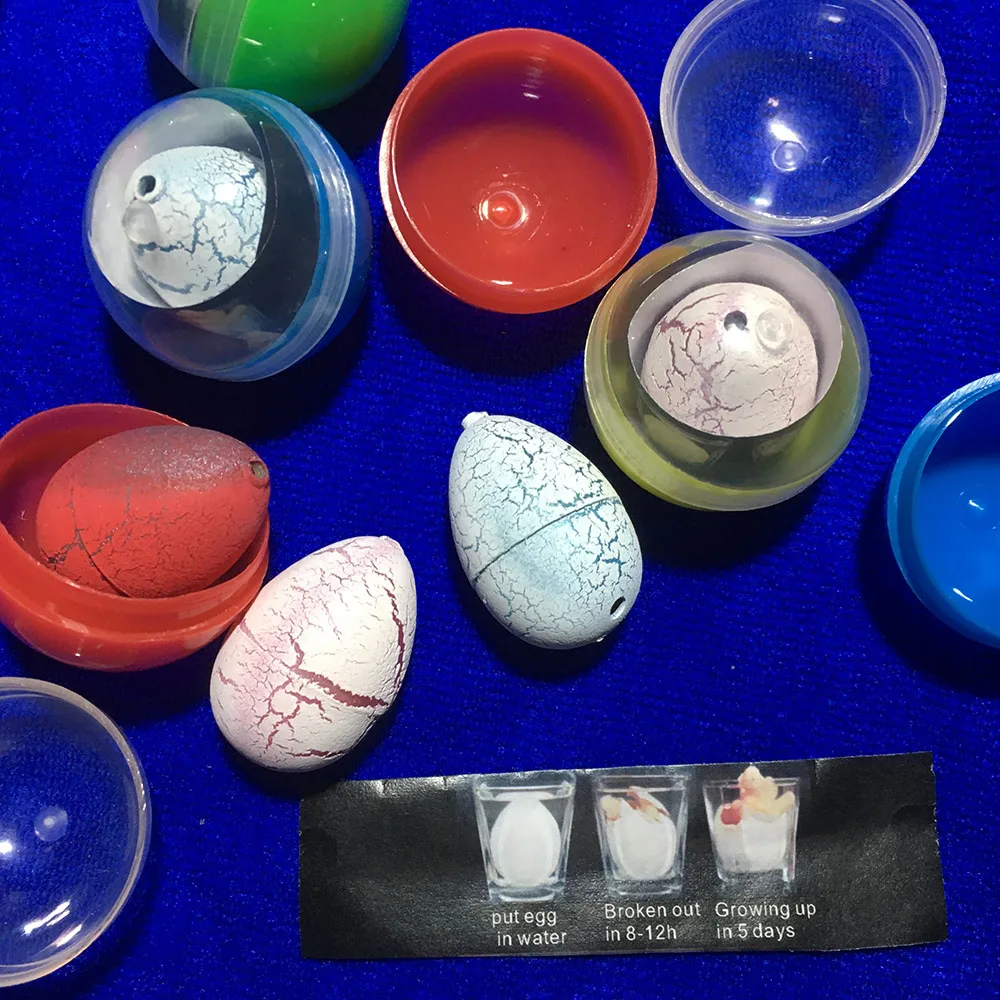 60 pcs/lot 32mm capsule en plastique jouet eau à couver oeuf de dinosaure rempli de boule en plastique jouets Surprise enfant jouets Surprise balle
