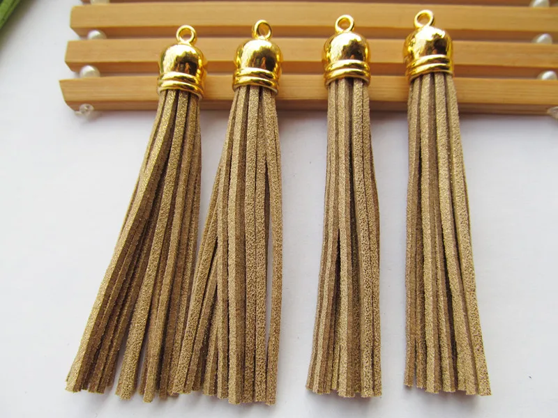 

Free Shipping 100Pcs 90mm Golden Suede Leather Jewelry Tassel For Key Chains/ Cellphone Charms Top Plated End Caps Cord Tip