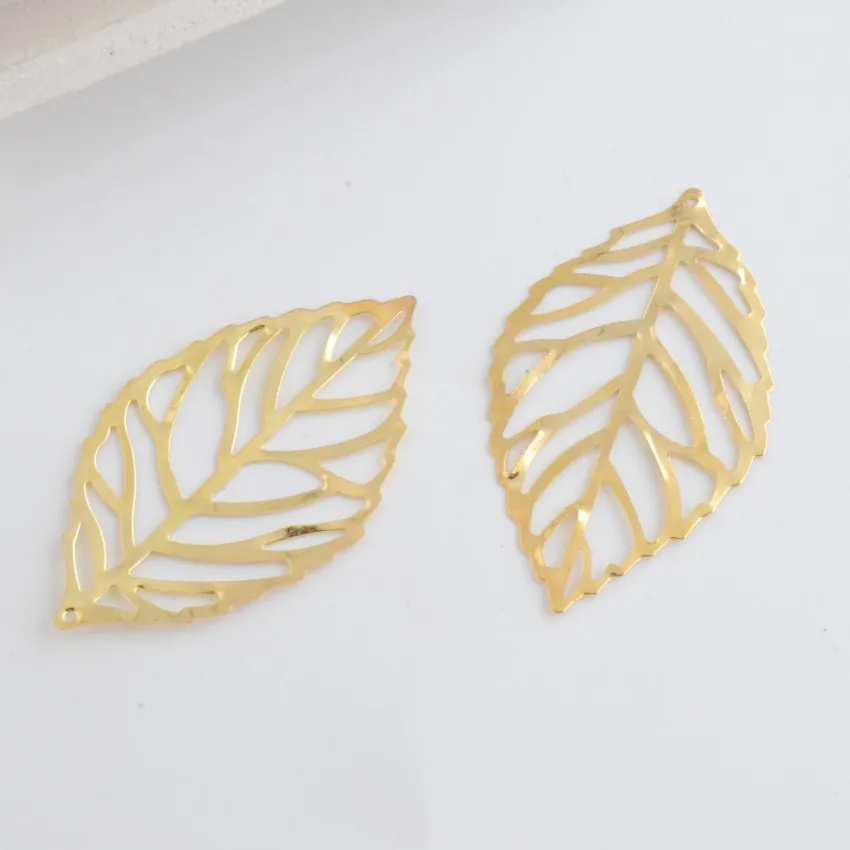 

MIAOCHI 100Pcs Gold Tone Filigree Leaf Metal Crafts Decoration DIY Findings 54x32mm J3129