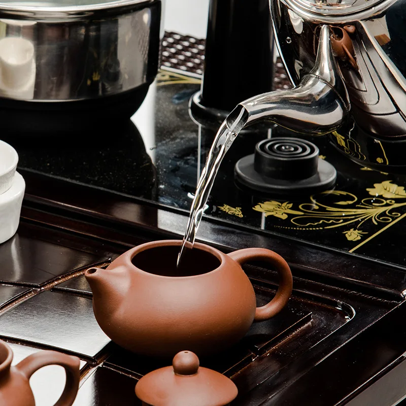 Kung Fu tea tea set Yixing special offer four in one electromagnetic oven Ru ceramic crystal solid wood tray