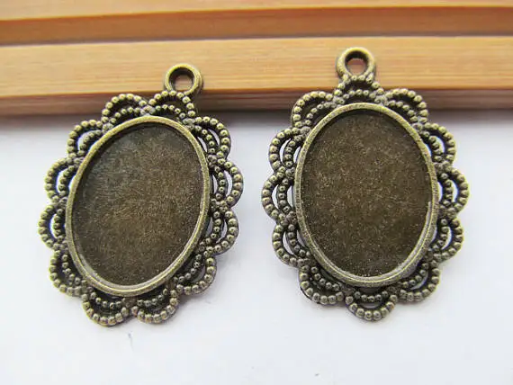 

100pcs Antique Silver tone/Antique Bronze Lace Border Base Bezel Setting Tray Pendant Charm,fit Oval 13mmx18mm Cabochon/Picture