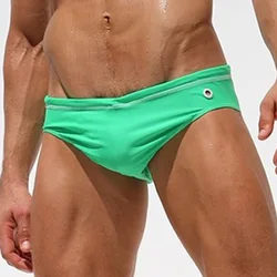 Slip da nuoto da uomo Sexy costumi da bagno Bikini a vita bassa solidi costume da bagno in Nylon ad asciugatura rapida Sport maschile Beach surf biancheria intima da bagno