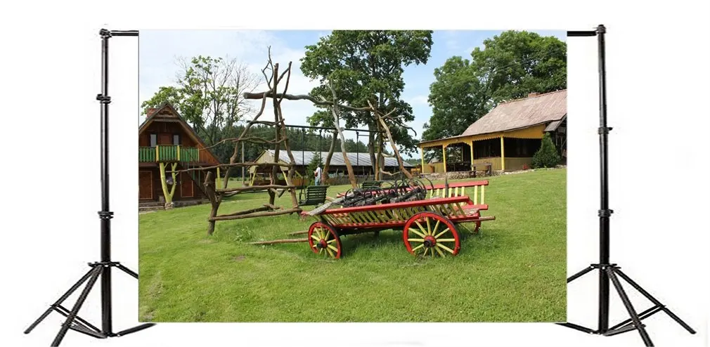 

Photography Backdrop Old Wood Coach Wheel on Green Field