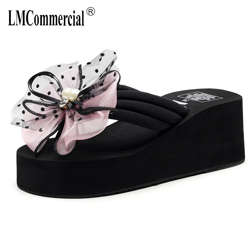 2019 New fashion outside the slope and sandals women's flip-flops Korean bow beach shoes cool slippers female summer