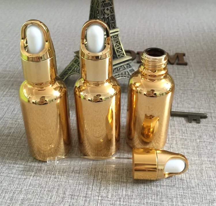 wholesale 100pcs gold 1 oz glass dropper bottles ,  golden 30ml glass dropper bottles for perfume , 1 oz dropper bottle glass