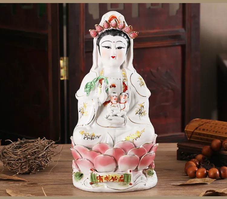 

Buddhists Worship Guanyin Bodhisattva As A Gift for Their Children. Hand-painted Pottery of Nanhai Guanyin Buddha Statue