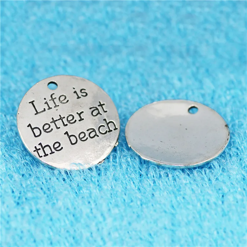 Top Quality 10 Pcs/lot Diameter 23mm Life is better at the beach Antique Silver plated Round Disc Quote Message Charms Pendant