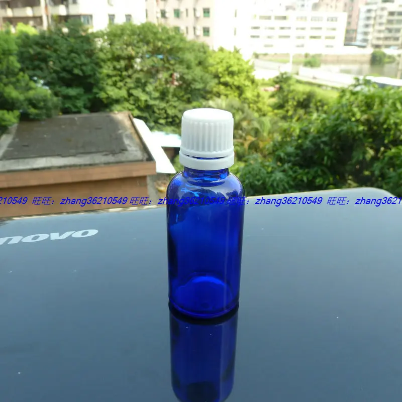 

30ml blue Glass Essential Oil Bottle With white plastic burglarproof cap. Oil vial, Essential Oil Container