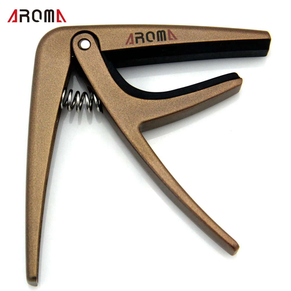 

Free shipping/AC-01 Guitar capo /High quality silicone cushion Dimension: 85*89*10mm Random Color (silver and gold)