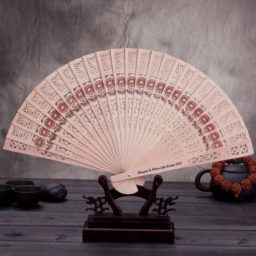 

Free shipping 100 pcs/lot Personalized /Customized Folding Hollow Carved Hand Fan with Tassel For Gift Organza Bag for Wedding