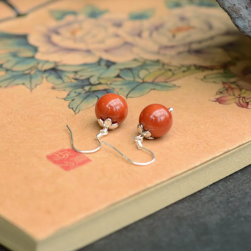 

Nanhong Agate Earrings simple Baitao natural Yunnan Baoshan Fozhu persimmon red flesh female 925 silver Tremella Pendant