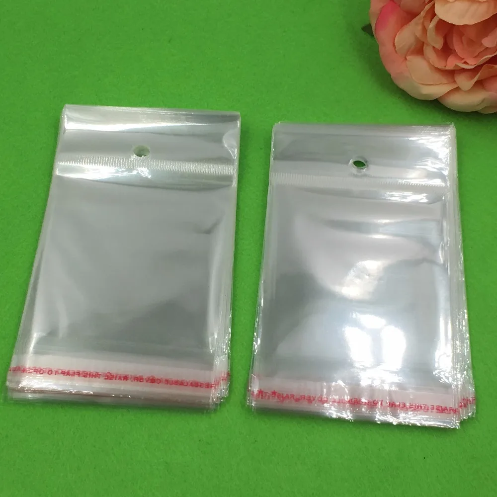 1000 pcs 12x6.5 cm Batal Transparan OPP Tas dengan Menggantung lubang Packing Plastik Tas Self Adhesive Seal tahan air OPP Tas