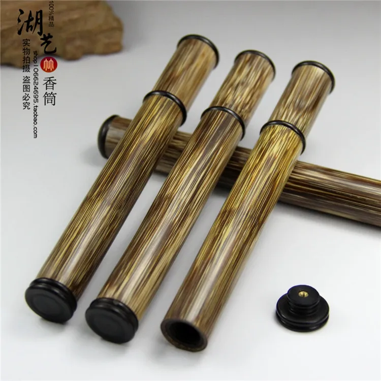 Delicate gold silk and ebony brief paragraph with inserted joss stick cylinder aloes lie sweet fume sweet sweet incense box tube