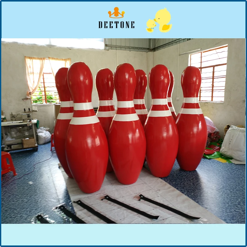 

Giant red inflatable bowling balls add a lot of fun to outdoor games.