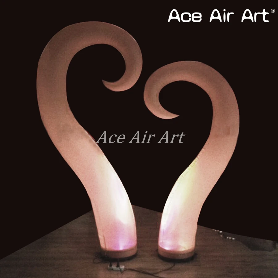 

Unique Shape Spiral Cone Inflatable Hook Style Pillars Horns with Base and Blower Spotlights for Stage and Party Decoration