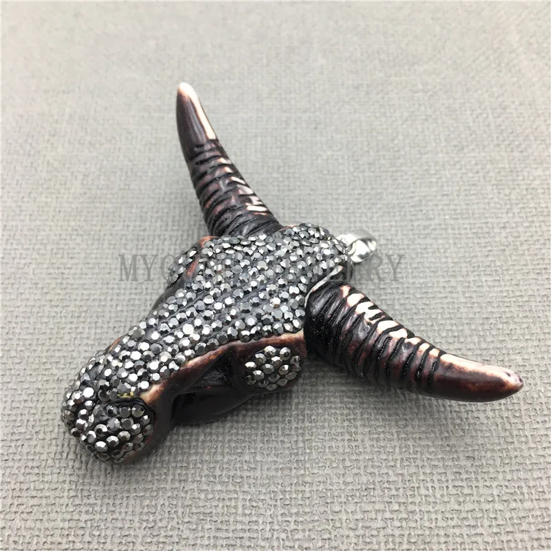 

Tribal Buffalo Horn Skull Pendant With Gunblack Toned Rhinestone Paved Approx.50*70mm MY0130