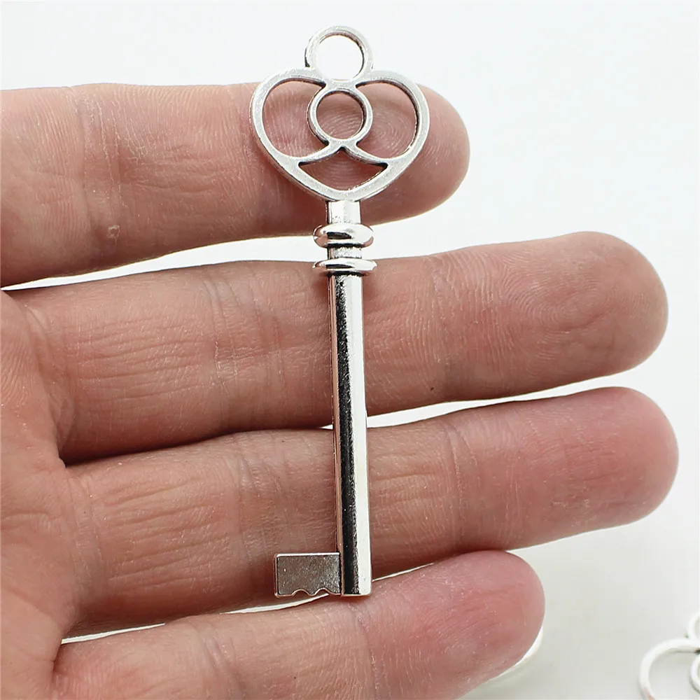 

Sweet Bell Wholesale 20pcs 19*60mm Antique Metal Zinc Alloy Trendy Hollow Lovely Key Jewelry Pendant Charms D0944