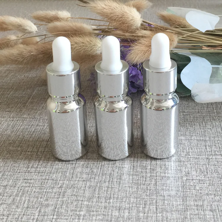 

hot sale high-grade 100pcs empty 10ml glass dropper bottles ,glass dropper bottle 10ml , silver colored glass bottles dropper