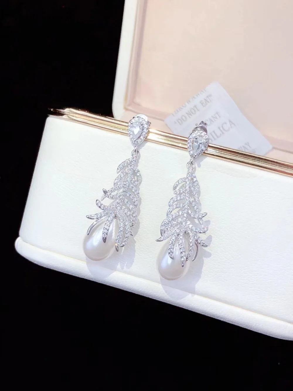 White Sea Shell Pearl Golden Plated Cz Pave Feather Earrings