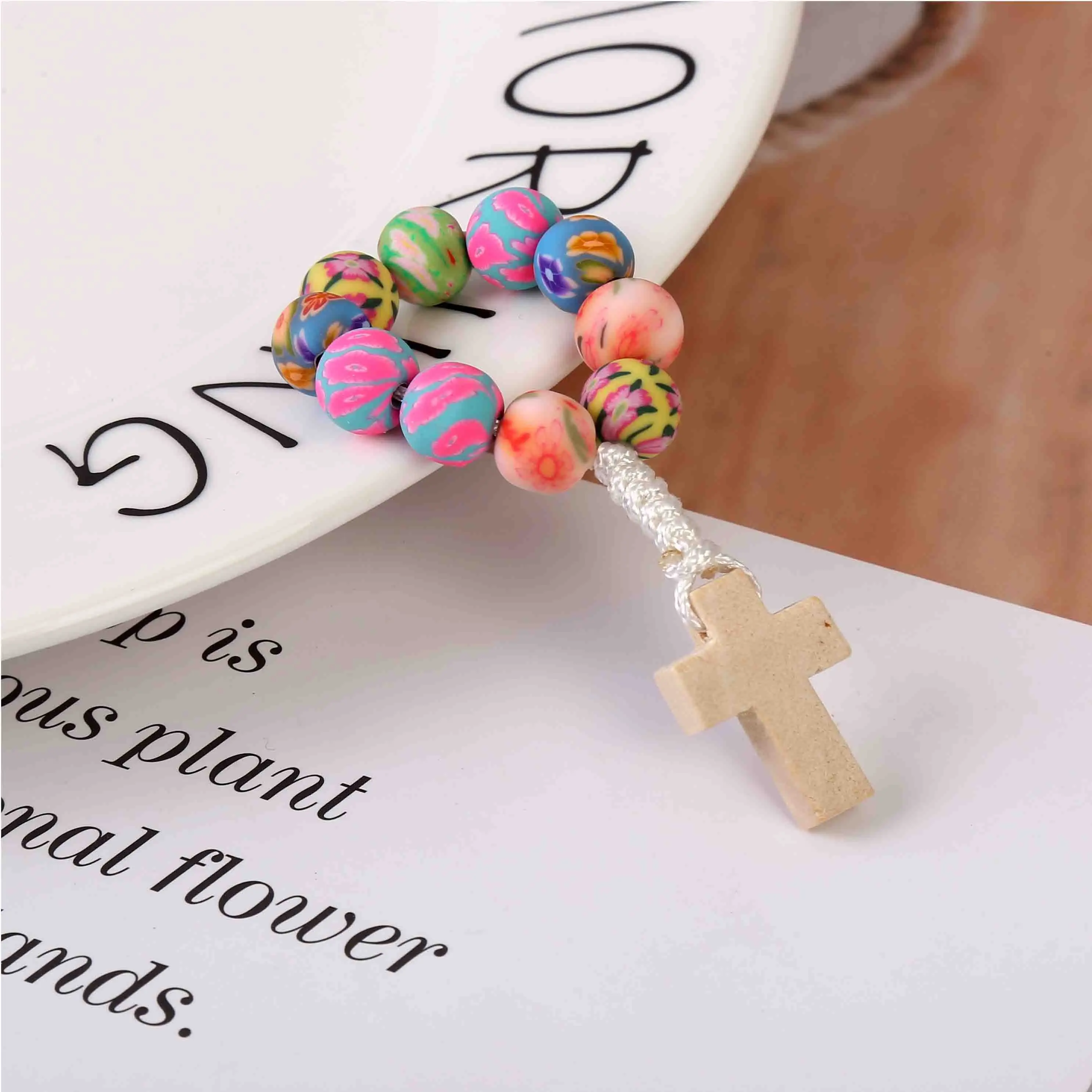 8mm soft ceramic beads rosary thumb bracelet. Pray soft ceramic bead bracelet. Soft clay woven wood cross finger chain