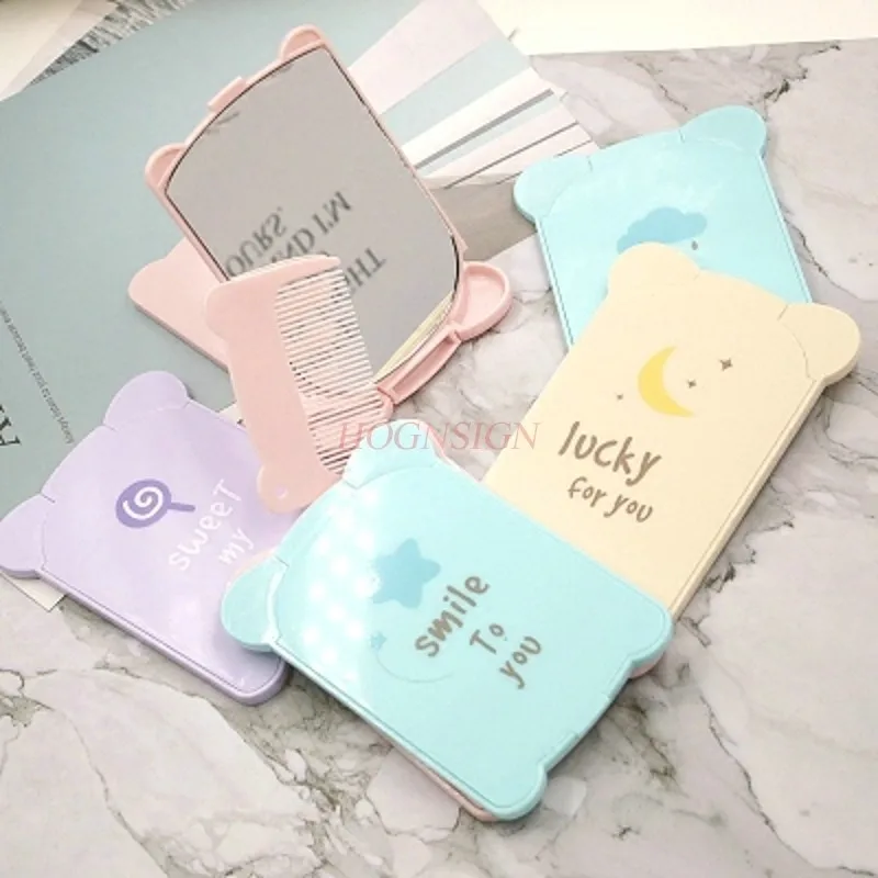 พับด้วยหวีกระจกขนาดเล็กกระจกพกพาแบบพกพามินิโต๊ะเครื่องแป้งภาพประกอบการ์ตูนพลาสติกขาย