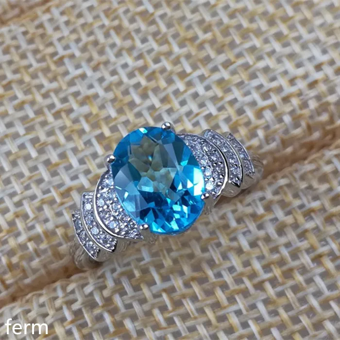 

KJJEAXCMY fine jewelry 925 sterling silver inlaid with natural blue topaz stone ring micro with exotic florets fire color