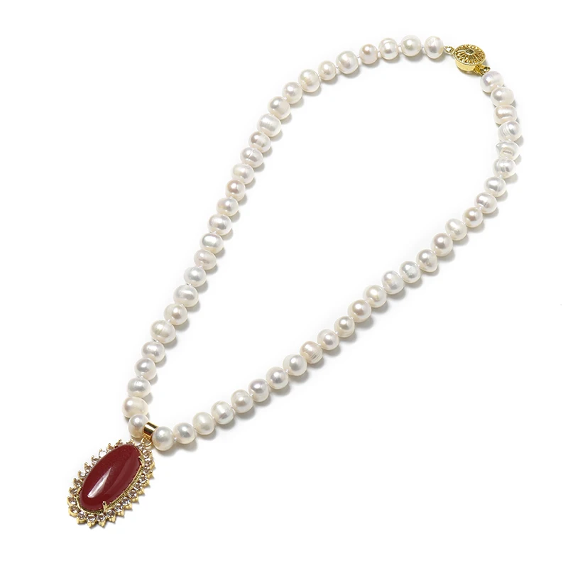 

Having a saffron Oval 24*40*10 MM Pendant with golden edges and pure white pearls 8-9 MM Freshwater Natural Pearl Necklace