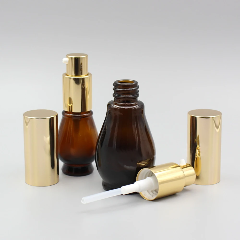 

100pcs/ lot cosmetic bottle 30ml amber ground shape pump glass bottle lotion with black and gold cap